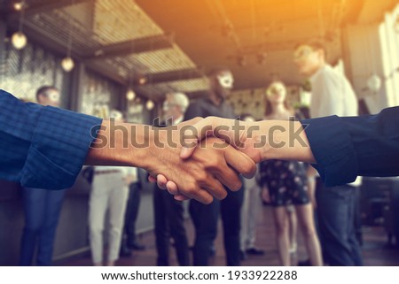 Close up people hands shake business partnership success, Shake hand concept Royalty-Free Stock Photo #1933922288