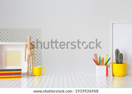Student creative desk mock up with colorful office supplies and cactus. Back to school. Royalty-Free Stock Photo #1933926968