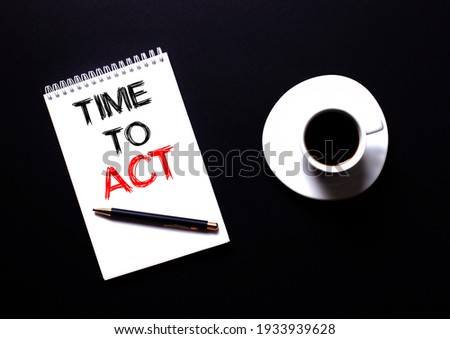 TIME TO ACT written in a white notebook in red type near a white cup of coffee on a black table. Motivational concept