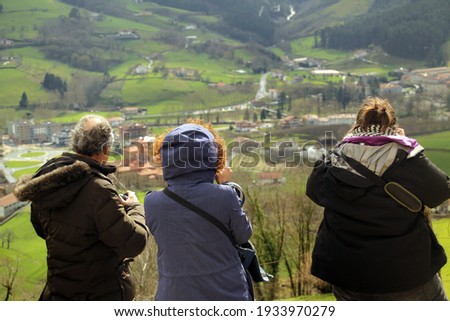 People taking pictures in the countryside