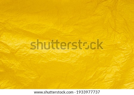 abstract background with wrinkled bright yellow paper for background. Royalty-Free Stock Photo #1933977737