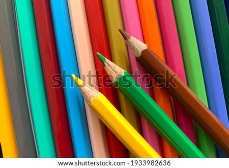 Multi coloured drawing pencil and background wallpeper