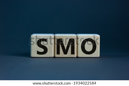 SMO, social media optimization symbol. Wooden cubes with word 'SMO - social media optimization' on beautiful grey background, copy space. Business, SMO - social media optimization concept.