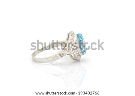 ring of the jeweler with blue sapphire and brilliants on a white background
