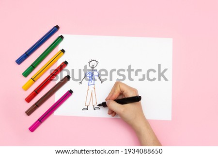 DIY drawing, child's drawing family - dad, mom and me. Children's creativity concept. Royalty-Free Stock Photo #1934088650