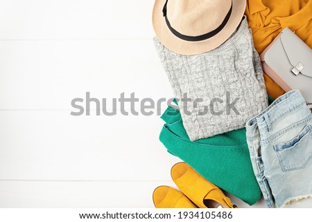 Second hand wardrobe idea. Circular fashion, eco friendly sustainable shopping, thrifting shop concept. Top view over woman outfit. Royalty-Free Stock Photo #1934105486