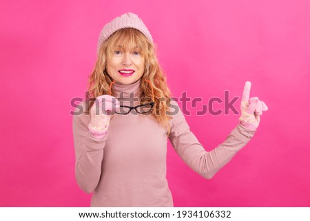 adult woman with glasses and warm clothes isolated on background