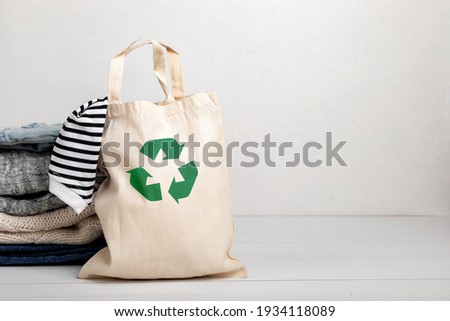 Second hand wardrobe idea. Circular fashion, eco friendly sustainable shopping, thrifting shop concept. Woman outfit. Royalty-Free Stock Photo #1934118089