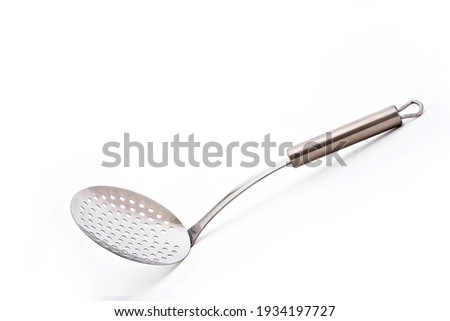 Stainless Steel Round Kitchen Skimmer or Skimmer Spoon Isolated on White Background, Skimming Ladle Royalty-Free Stock Photo #1934197727