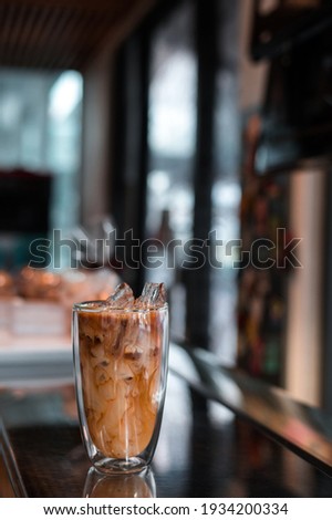 glass of iced coffee with milk on the table