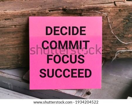 Business concept. Phrase DECIDE COMMIT FOCUS SUCCEED written on sticky note.