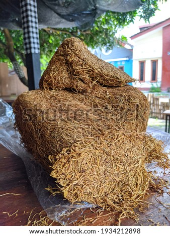 The chopped tobacco produced by Indonesian farmers looks yellowish brown