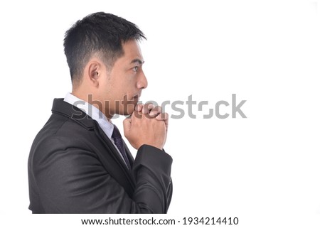 Portrait of young handsome business man in black suit,tie with thinking about question with hand 

