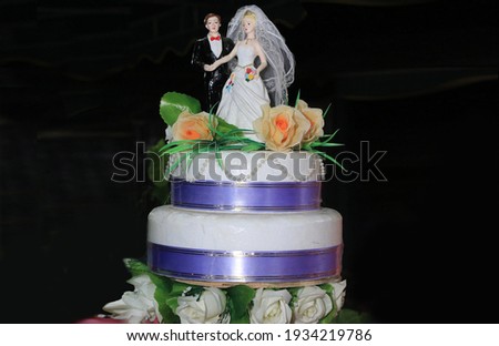 The wedding cake is a symbol of the character of the bride and groom because it shows the creativity of the bride and groom in designing a wedding cake as a picture of their personalities