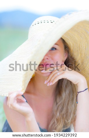 Beautiful girl is resting on the beach. Woman by the sea.