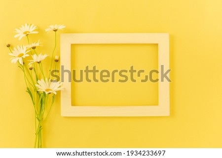 frame with flowers in yellow background