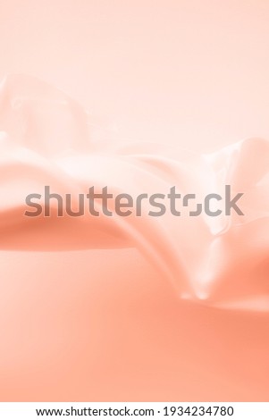 Peach rose petal colored fabric textile background