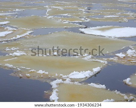 ice floes floating on the river during the spring ice drift. High quality photo