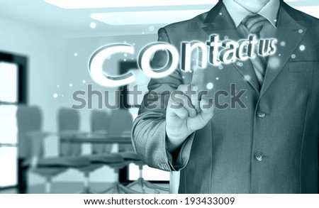 Businessman pushing CONTACT US sign