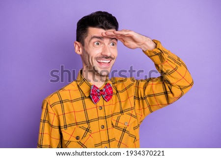 Photo of young man happy positive smile hand touch forehead look forward isolated over violet color background