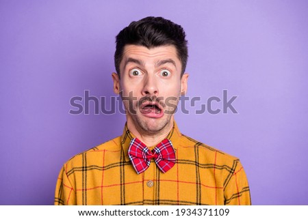 Photo of young man amazed shocked surprised worried nervous panic problem isolated over violet color background