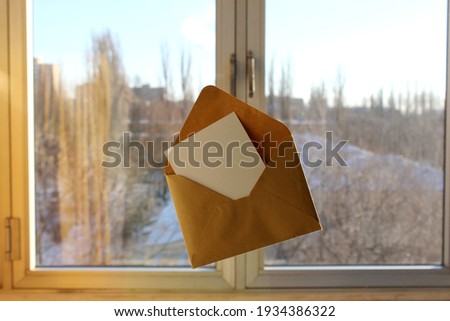 An open envelope with a postcard. Postcard mockup. 