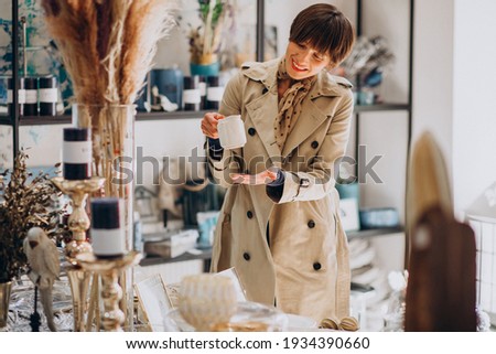 Woman buying stuff in a decoration store