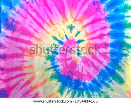 tie dye pattern hand dyed on cotton fabric abstract texture background Royalty-Free Stock Photo #1934414165