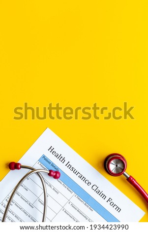 Medical care concept. Health insuranse claim form, top view