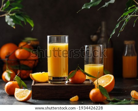A glass of orange juice on dark background Royalty-Free Stock Photo #1934426228