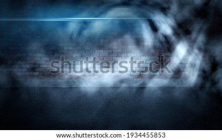 Dark brick wall background and texture concrete floor is smoke or mist that reflects white light, Blue tones neon searchlight. Sci-fi science action and future concepts.