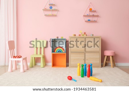 Stylish interior of modern playroom in kindergarten Royalty-Free Stock Photo #1934463581