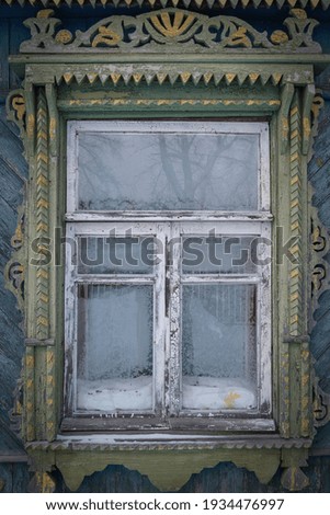 Window of an old, rustic, wooden house with.