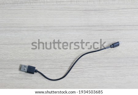 USB cable on wood background