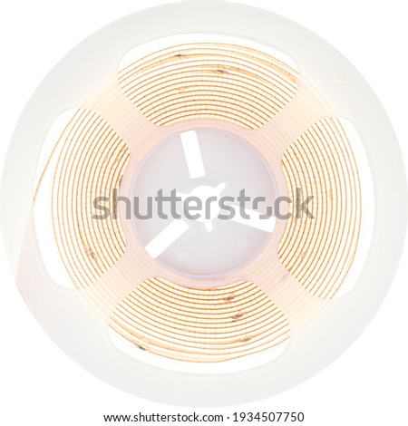 Glowing led strip in roll on white background.