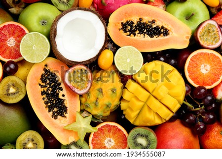Many different delicious exotic fruits as background, top view Royalty-Free Stock Photo #1934555087