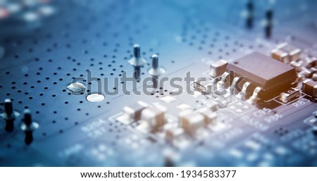 Printed circuit board with electrical components. macro photography Royalty-Free Stock Photo #1934583377