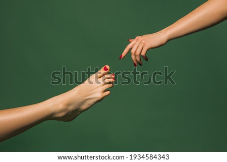 Touch of God. Bright fashionable hand and leg working up daily things together. Modern artwork, contemporary art. Trendy colors, magazine style. Usual routine in unusual way. Green background.
