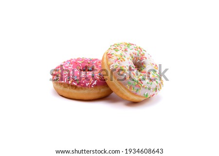 glazed doughnuts with bright colored sprinkles,isolated on a white background. Royalty-Free Stock Photo #1934608643