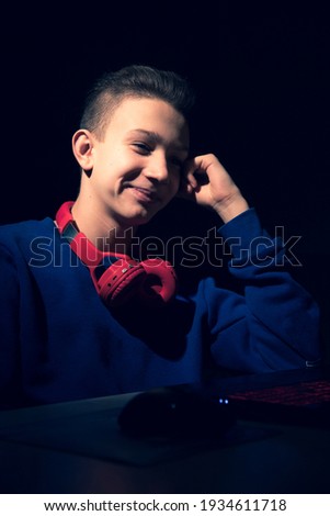 Young Guy Gamer Plays Online Games. Guy with Headphones. Portrait Gamer