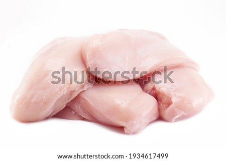 Fresh raw chicken breast fillet isolated on white background, clipping path Royalty-Free Stock Photo #1934617499