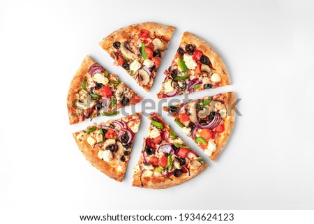 slices of fresh round pizza with chicken meat, vegetables, mushrooms and cheese top view on a white and gray background. natural shadow with copy space Royalty-Free Stock Photo #1934624123