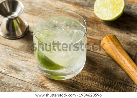 Boozy Refreshing Rhum Ti Punch with LIme Juice Royalty-Free Stock Photo #1934628596
