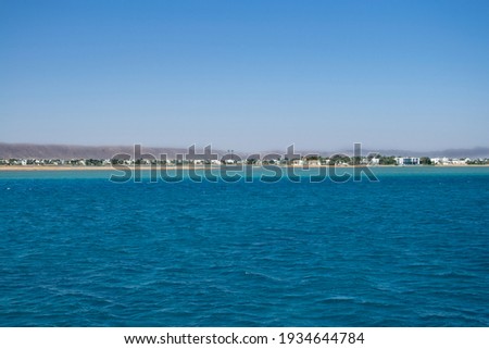 Red sea coral reef and blue sky. El Gouna, Egypt