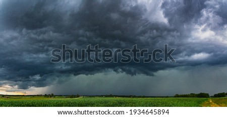 Supercell storm clouds with hail and intence winds Royalty-Free Stock Photo #1934645894