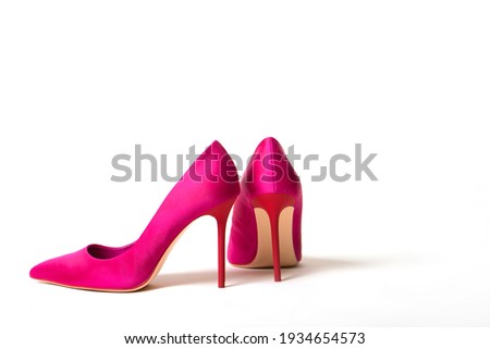 Elegant fuchsia high heel shoe on white background Royalty-Free Stock Photo #1934654573