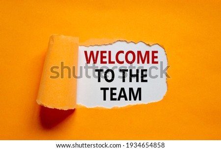 Welcome to the team symbol. Words 'Welcome to the team' appearing behind torn orange paper. Beautiful orange background. Business, welcome to the team concept, copy space.