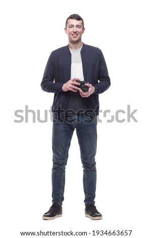 young man with a camera. isolated on a white