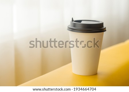 Paper cup for coffee, tea with an empty space for logo.