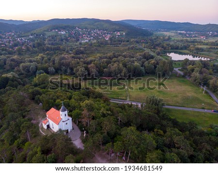 Aerial view of the hilltop chapel (St. Michael's Chapel) near Lake Balaton, at Vonyarcvashegy at sunset in Hungary